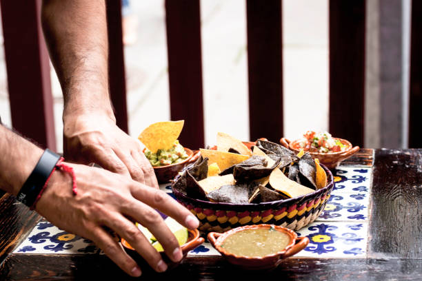 istock Waiter at Mexican Restaurand arranging meal on the Table 1136606414