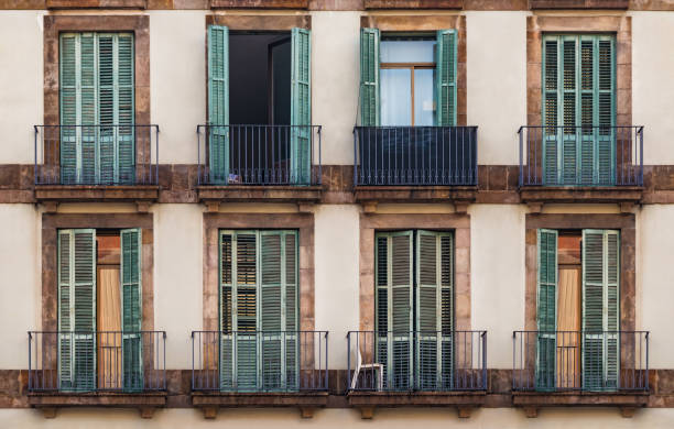 istock Windows and balconies in row on facade of historic building 1136610499
