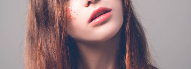 istock female beauty natural makeup soft shiny lips 1136610633