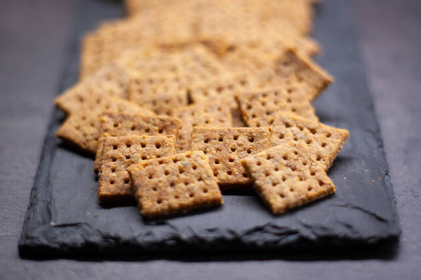 istock Homemade baked parmesan cheesse crackers with rosemary 1136613010