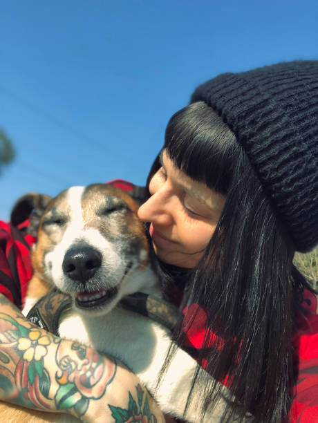 istock Beautiful young woman with dog 1136613599
