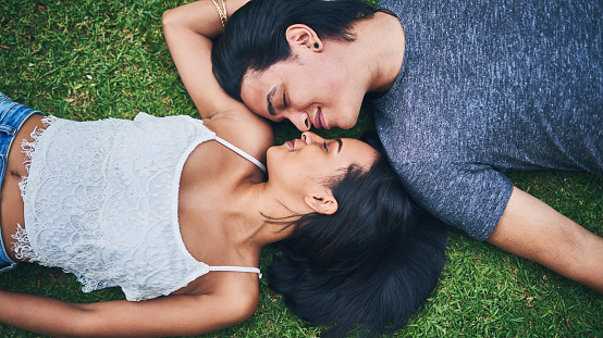 Shot of a happy young couple spending the day at the park