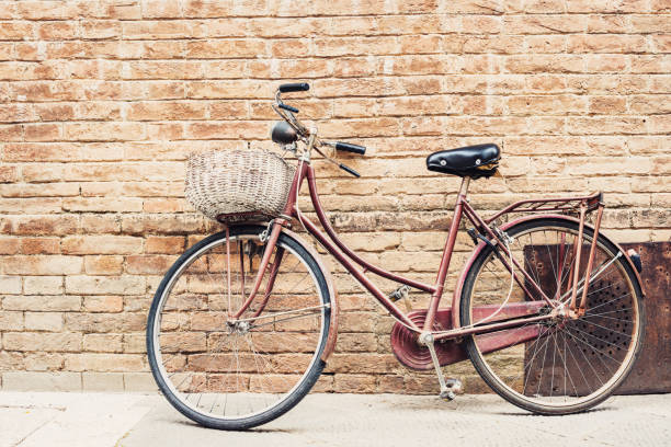 Vintage bicycle leaning on a street wall