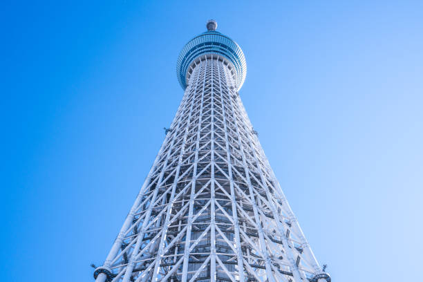 TOKYO, JAPAN - November 21, 2018: A part of Japan Tokyo skytree tower building with a blue sky TOKYO, JAPAN - November 21, 2018: A part of Japan Tokyo skytree tower building with a blue sky sumida ward photos stock pictures, royalty-free photos & images