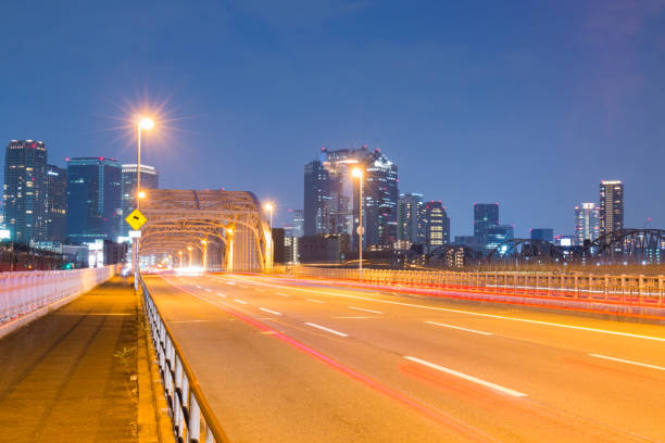 Beautiful road on bridge at Umeda from across the Yodogawa River.