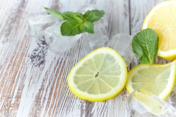 istock cut lemon on wooden table large plan. horizontal view. citrus fruit. copy space. 1136617634