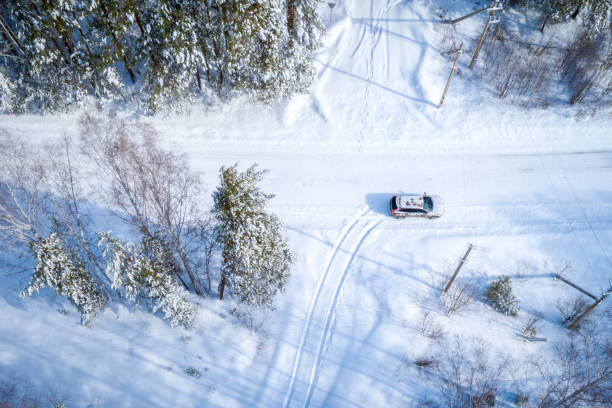 istock Road through the winter forest, aerial view 1136619339