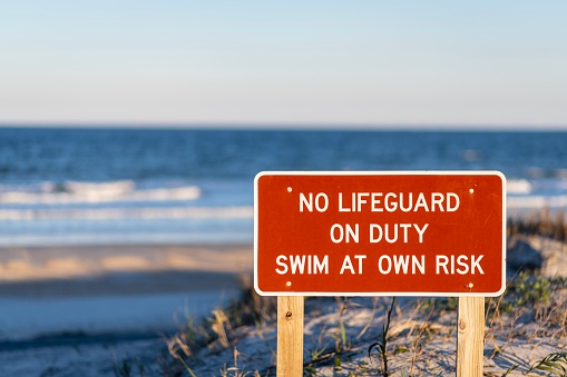 No lifeguard sign on a beach