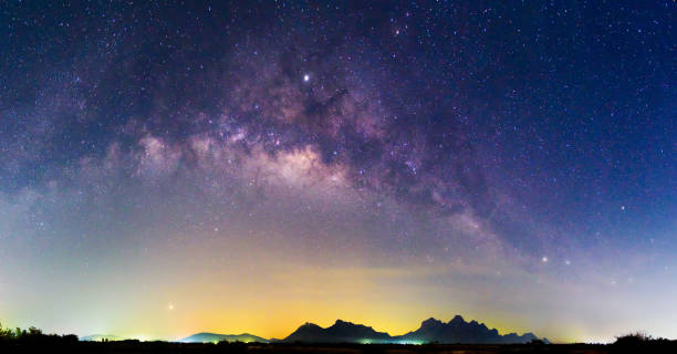 istock Panorama milky way at the lake with reflections in night time 1136621791