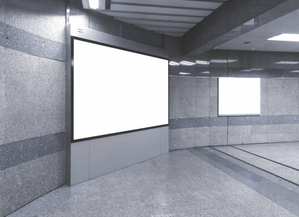istock blank billboard white screen LED horizontal advertising banner board indoor in subway station ad interior public hall. 1136621818