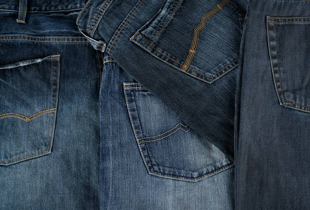 istock Lots of blue classic jeans stacked chaotically 1136622724