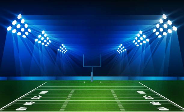istock Football arena field with bright stadium lights vector design and information scoreboard. Vector illumination 1136625981