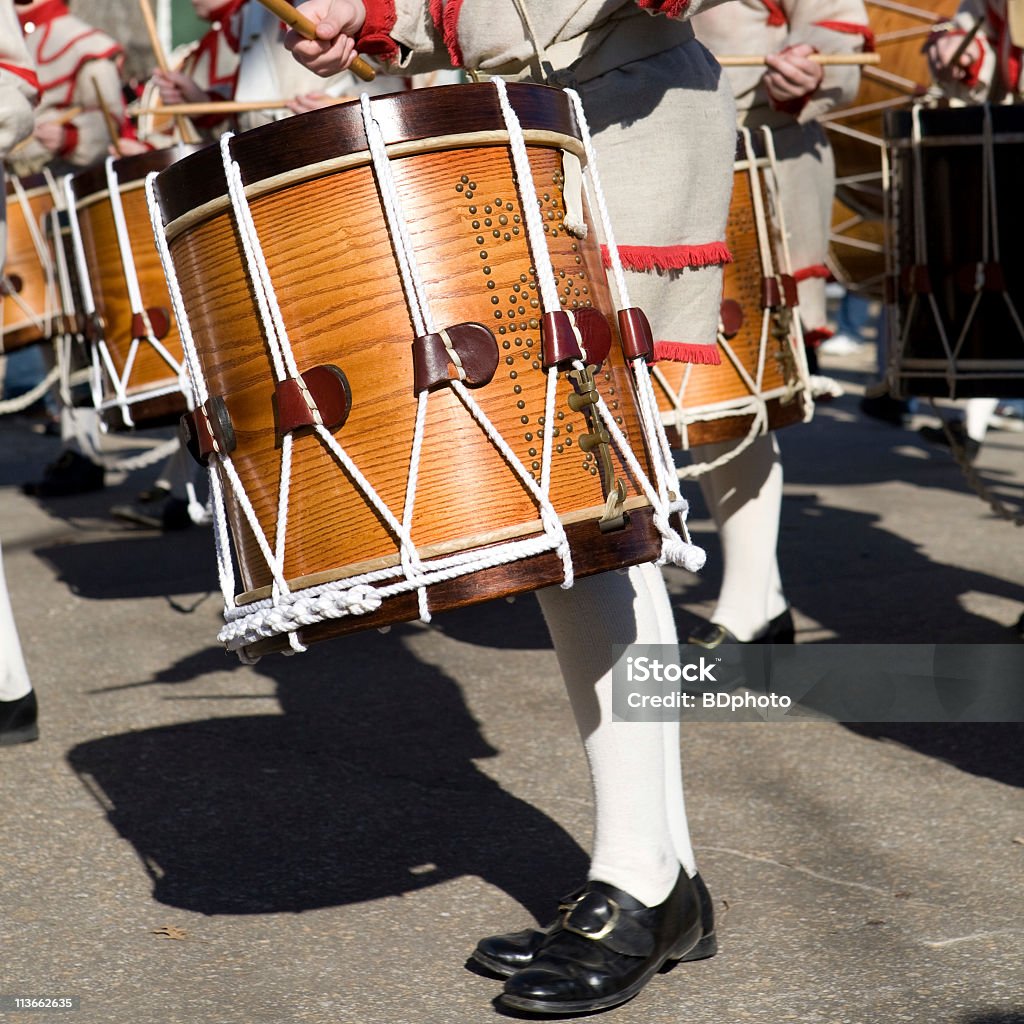 Colonial drummers in a parade in Williamsburg, Virginia The Colonial Williamsburg Fifes and Drums – also known as the Field Music of the Virginia State Garrison Regiment – carries forward the tradition of military music. Since 1958, visitors in the Historic Area have enjoyed the musical performances and experienced the history of America's Revolution.  Williamsburg - Virginia Stock Photo