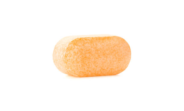 vitamine c seul comprimé isolé sur fond blanc - pill vitamin b vitamin pill orange photos et images de collection