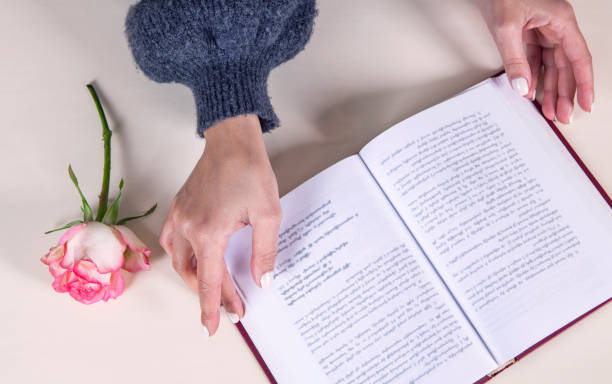 girl reading book and flower