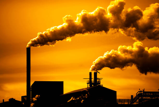 Pollution and smoke from chimneys of factory or power plant
