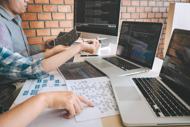 istock Team of Professional Developer programmer cooperation meeting and brainstorming and programming in website working a software and coding technology, writing codes and database 1136629859