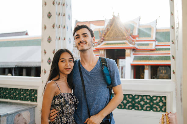 istock Young couple exploring a temple in Bangkok 1136632370