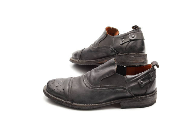 istock two old black used shoes 1136632756