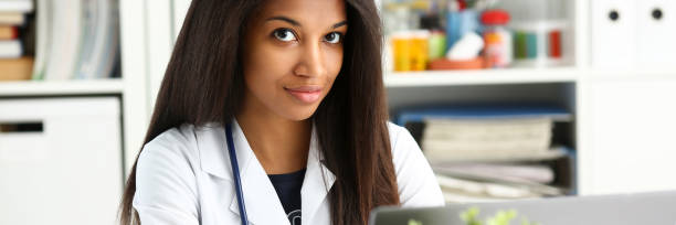 istock Beautiful black smiling female doctor 1136633919