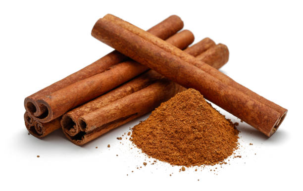 istock Cinnamon sticks and powder isolated on white 1136634593