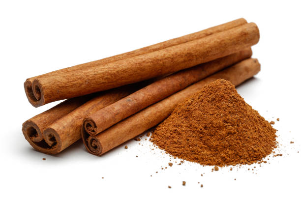 istock Cinnamon sticks and powder isolated on white 1136635416
