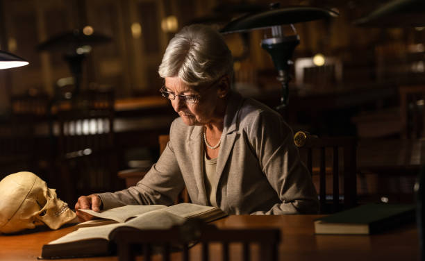istock Senior Female Professor In Old Library 1136635787