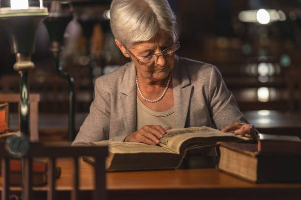 istock Senior Female Professor In Old Library 1136635830