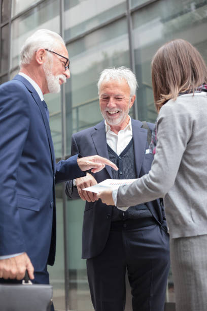 istock Small mixed group of business people having a meeting, discussing sales reports 1136637113