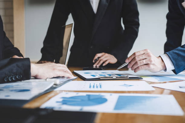 istock Executive team discussing the charts and graphs working in business strategy and financial plan to investment profit, discussing working analysis with financial data and marketing growth report 1136637573