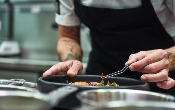 istock Creative Cooking. Cropped image of chef hands garnishing Pasta carbonara in a restaurant kitchen. 1136639087