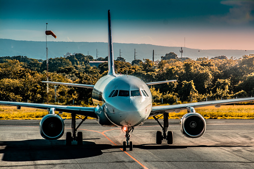 The plane taxiing on runway ready to take off