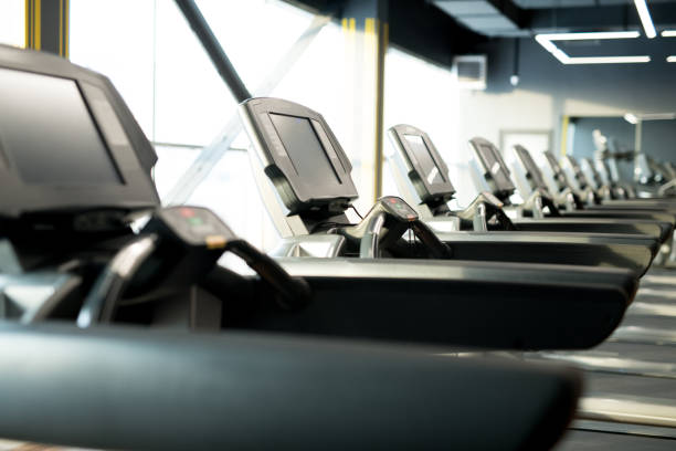 istock Row of treadmills in gym 1136639443
