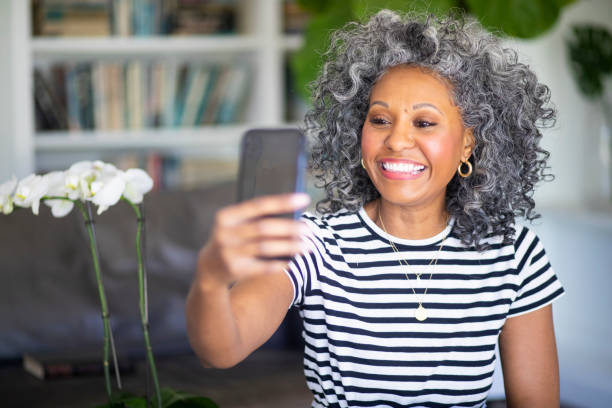 Black Woman Recording a Video Message on her Smartphone