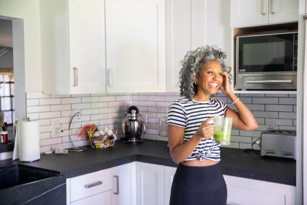 istock Mature Black Woman Drinking a Green Smoothie 1136640749