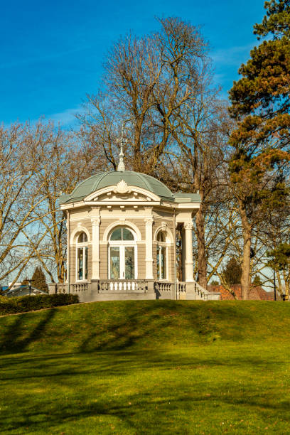 istock Tea dome or Gloriette with neoclassical decorations on a hill with green grass and trees 1136640976