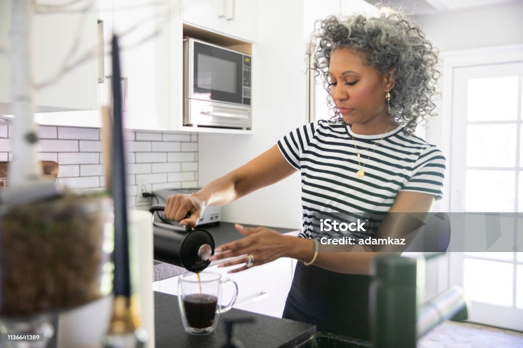 Mature Black Woman Making Coffee Stock Photo - Download Image Now - Coffee  - Drink, Preparation, Women - iStock