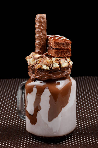 istock Chocolate extreme milkshake with brownie cake, chocolate paste and sweets. Crazy freakshake food trend. Copy space 1136641441