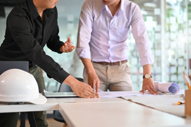 istock Engineer planing and Architecture working achievement Planning Design Draw teamwork of architecture meeting. 1136642563