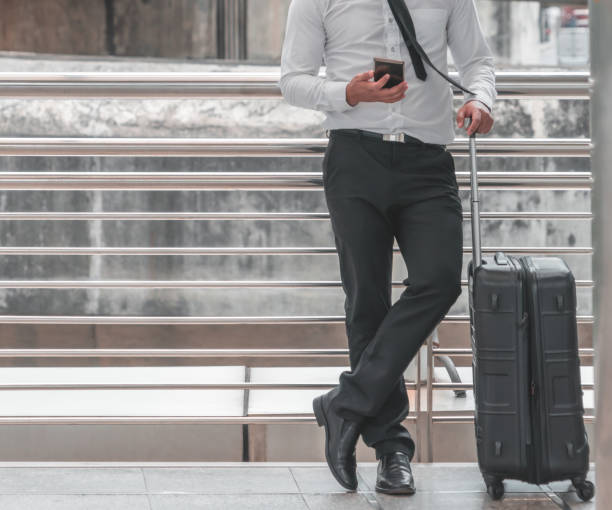 istock Business man traveller with luggage on train station 1136642709