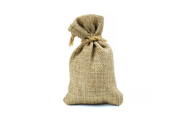 Single bound bag sackcloth isolated on white background. Carefully cutout by pen tool and clipping path include. Use natural-made bags to reduce global warming concept.