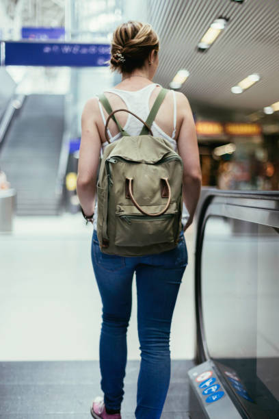 istock Young girl at the train station: Journey 1136644101