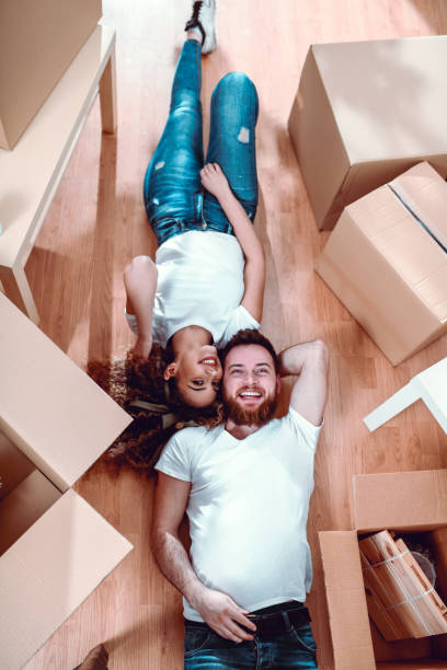 istock Cute Couple Relaxing Before Unpacking 1136644124