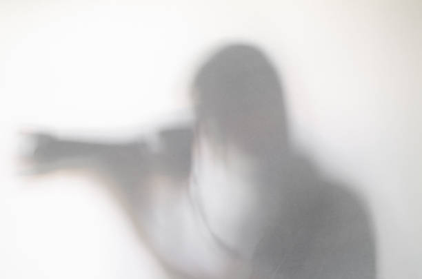 istock Photographer with camera behind curtain. 1136646265