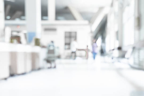 istock Abstract blurred white doctor medical office room background concept for blur empty space grey modern hospital clinic pharmacy, light clean interior retail sale, blue glare window hallway building 1136647636