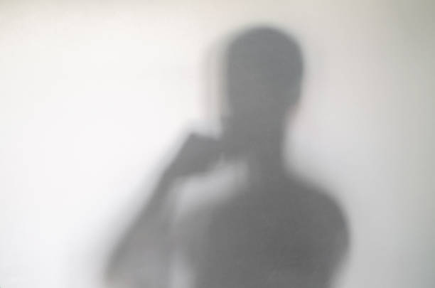 istock Man in crossed arms thinking pose behind curtain. 1136648044