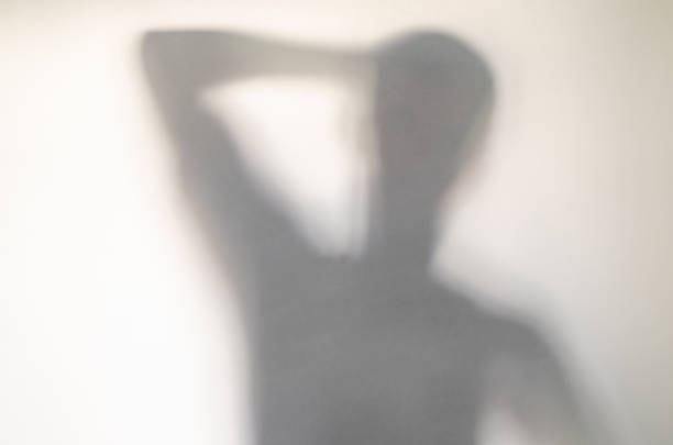 istock Spooky confused man behind curtain. 1136648866