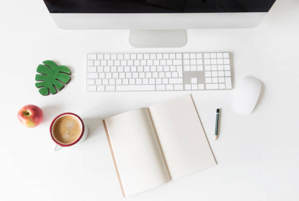 Place of work Place of work. Office desk.top view apple keyboard stock pictures, royalty-free photos & images