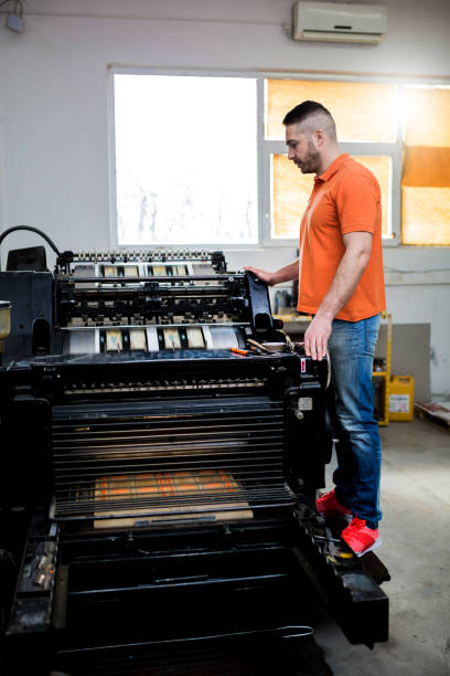 istock Man working in printing factory 1136651771