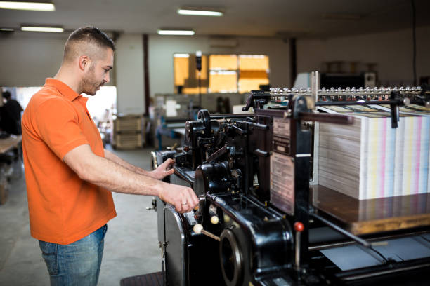 istock Man working in printing factory 1136653190